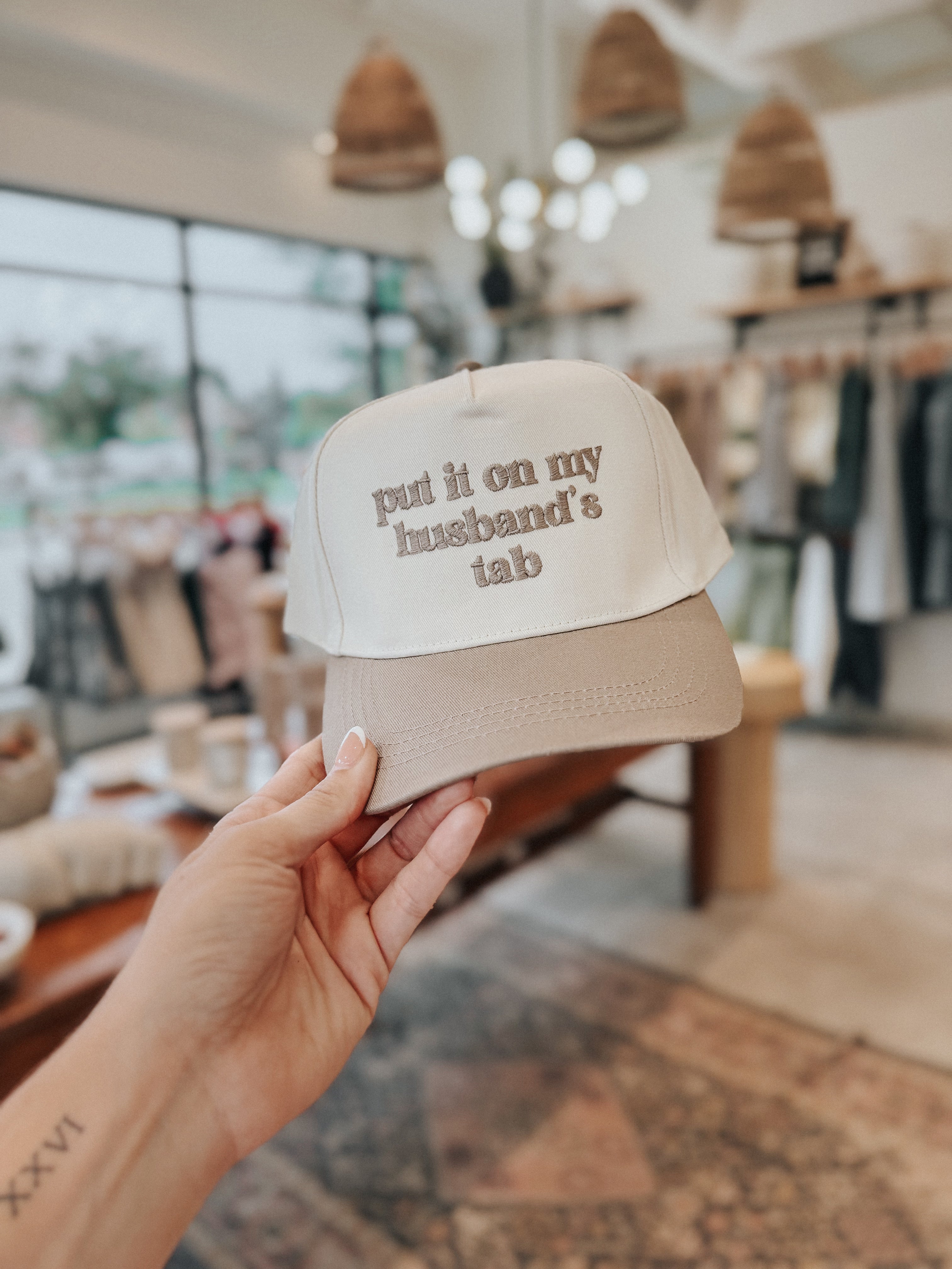 Put It On My Husband’s Tab Trucker Hat
