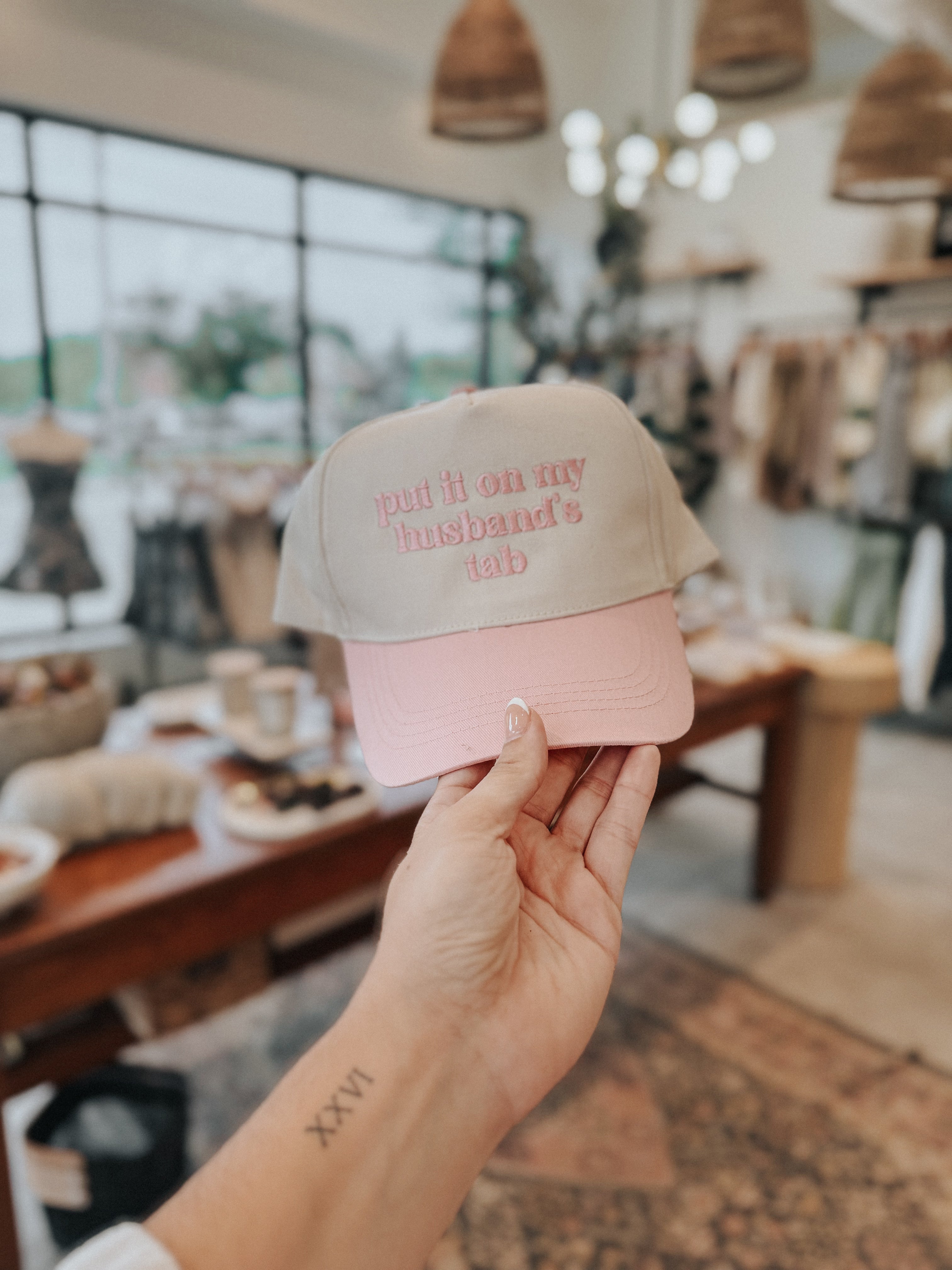 Put It On My Husband’s Tab Trucker Hat